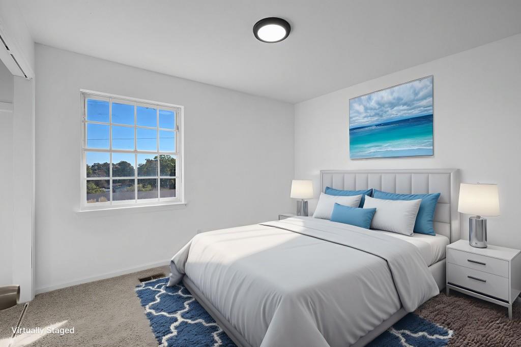 1717 East Rebel Road Rossville, GA 30741 - Photo 17 of 36 a bedroom with bed and window