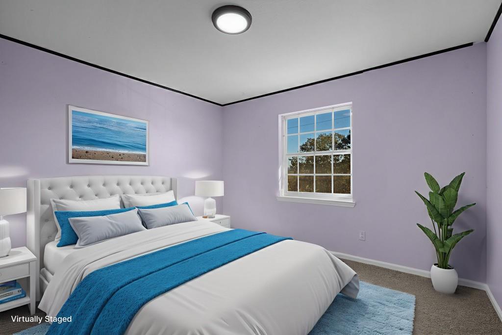 1717 East Rebel Road Rossville, GA 30741 - Photo 19 of 36 a bedroom with a bed and a potted plant