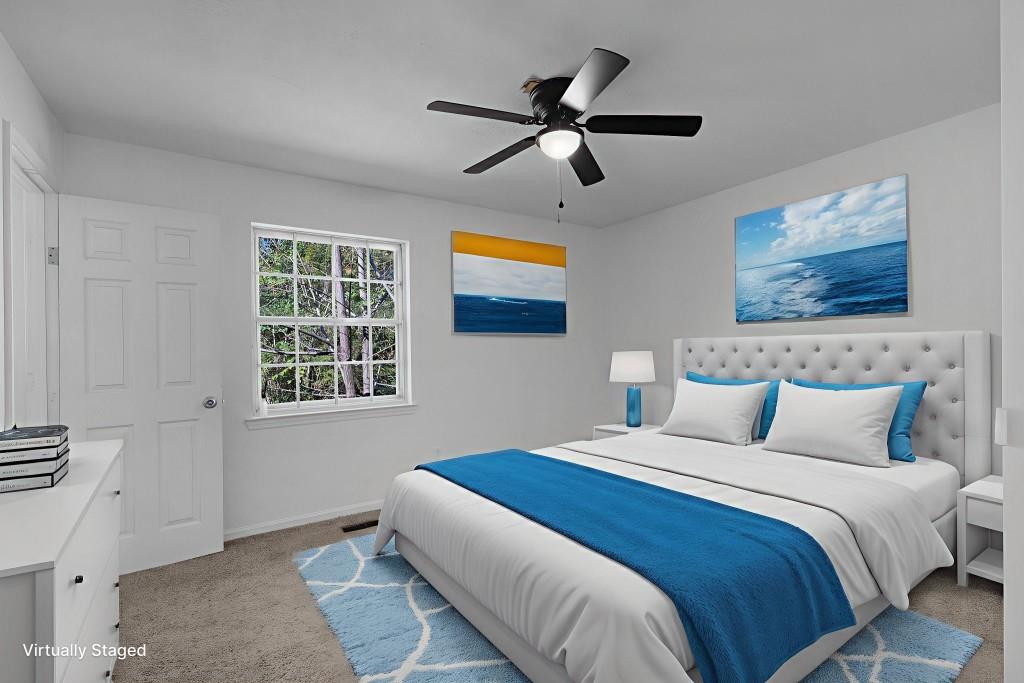 1717 East Rebel Road Rossville, GA 30741 - Photo 22 of 36 a bedroom with a bed and a window