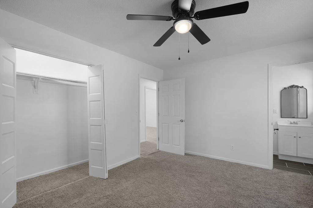 1717 East Rebel Road Rossville, GA 30741 - Photo 24 of 36 an empty room with chandelier fan