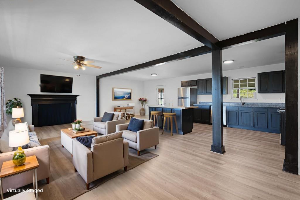 1717 East Rebel Road Rossville, GA 30741 - Photo 3 of 36 a living room with fireplace furniture and a flat screen tv