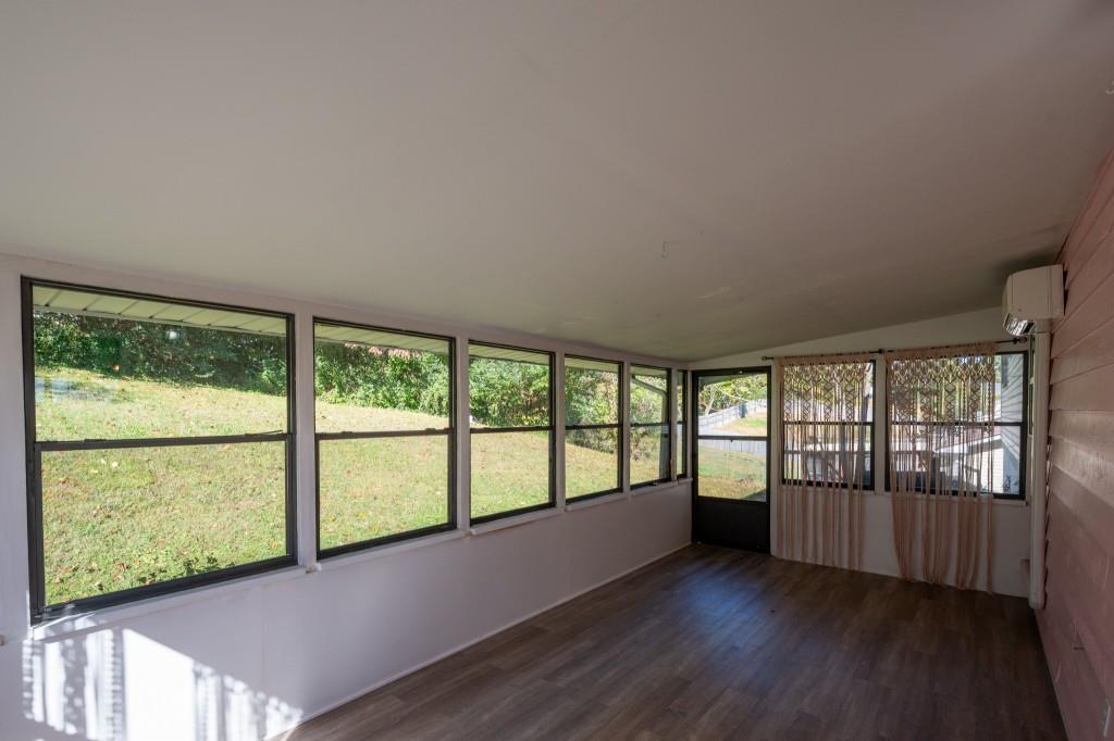 1717 East Rebel Road Rossville, GA 30741 - Photo 32 of 36 an empty room with wooden floor and windows