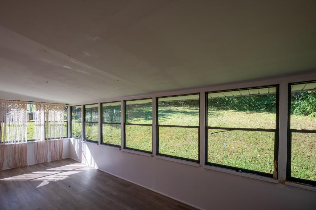 1717 East Rebel Road Rossville, GA 30741 - Photo 33 of 36 wooden floor in an empty room with a window