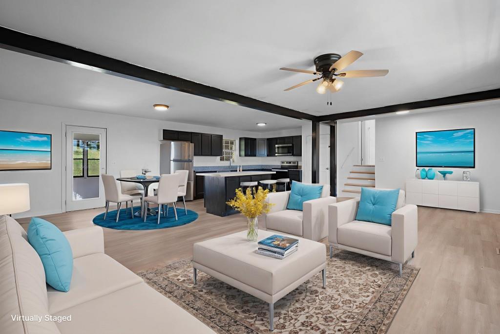 1717 East Rebel Road Rossville, GA 30741 - Photo 8 of 36 a living room with fireplace furniture and a wooden floor