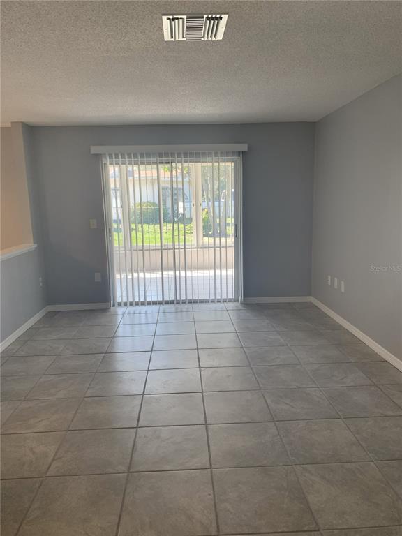 2144 Deltona Boulevard Spring Hill, FL 34606 - Photo 11 of 12 a view of an empty room with a window