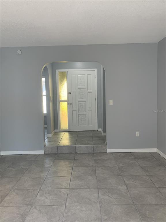 2144 Deltona Boulevard Spring Hill, FL 34606 - Photo 2 of 12 a view of an empty room with a window