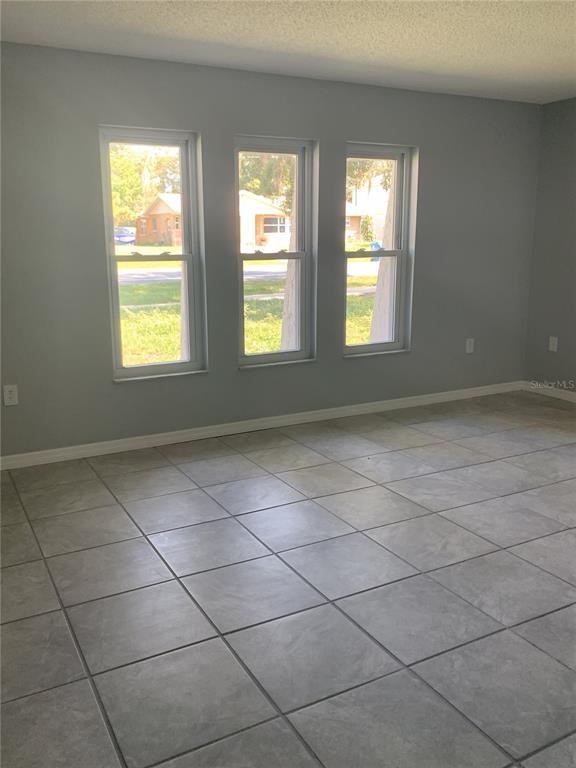 2144 Deltona Boulevard Spring Hill, FL 34606 - Photo 3 of 12 a view of an empty room with a window