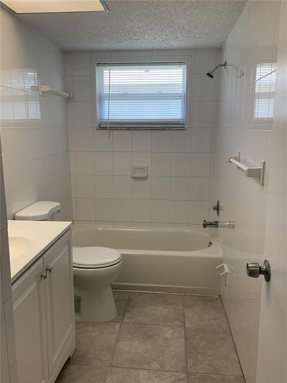 2144 Deltona Boulevard Spring Hill, FL 34606 - Photo 8 of 12 a bathroom with a toilet a sink and bathtub