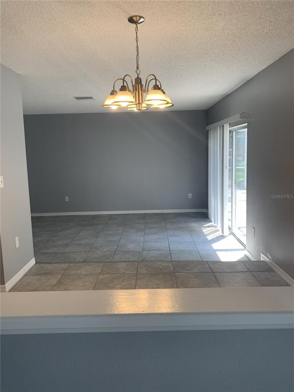 2144 Deltona Boulevard Spring Hill, FL 34606 - Photo 10 of 12 a view of a chandelier fan in a room