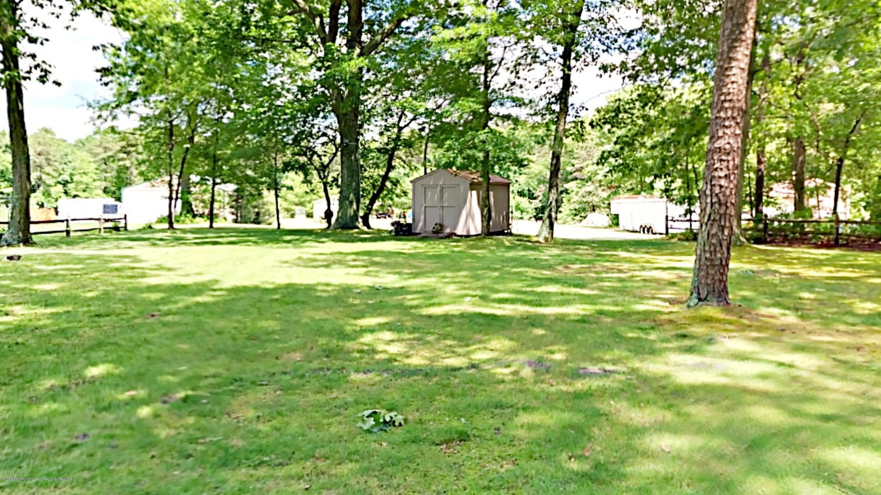 890 Anderson Road Jackson, NJ 08527 - Photo 14 of 17 a big yard with lots of green space and trees