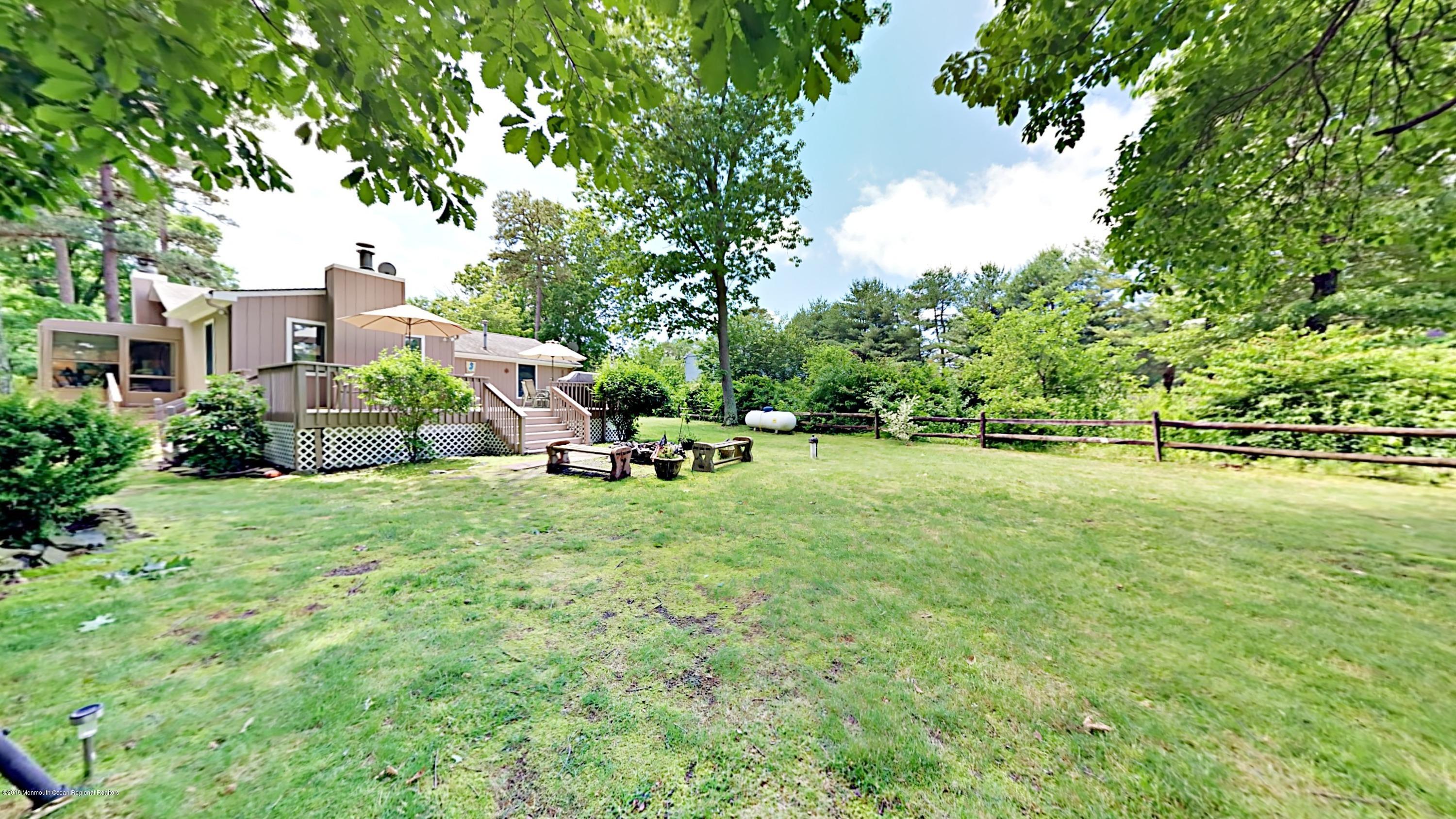 890 Anderson Road Jackson, NJ 08527 - Photo 16 of 17 a view of outdoor space with garden and trees