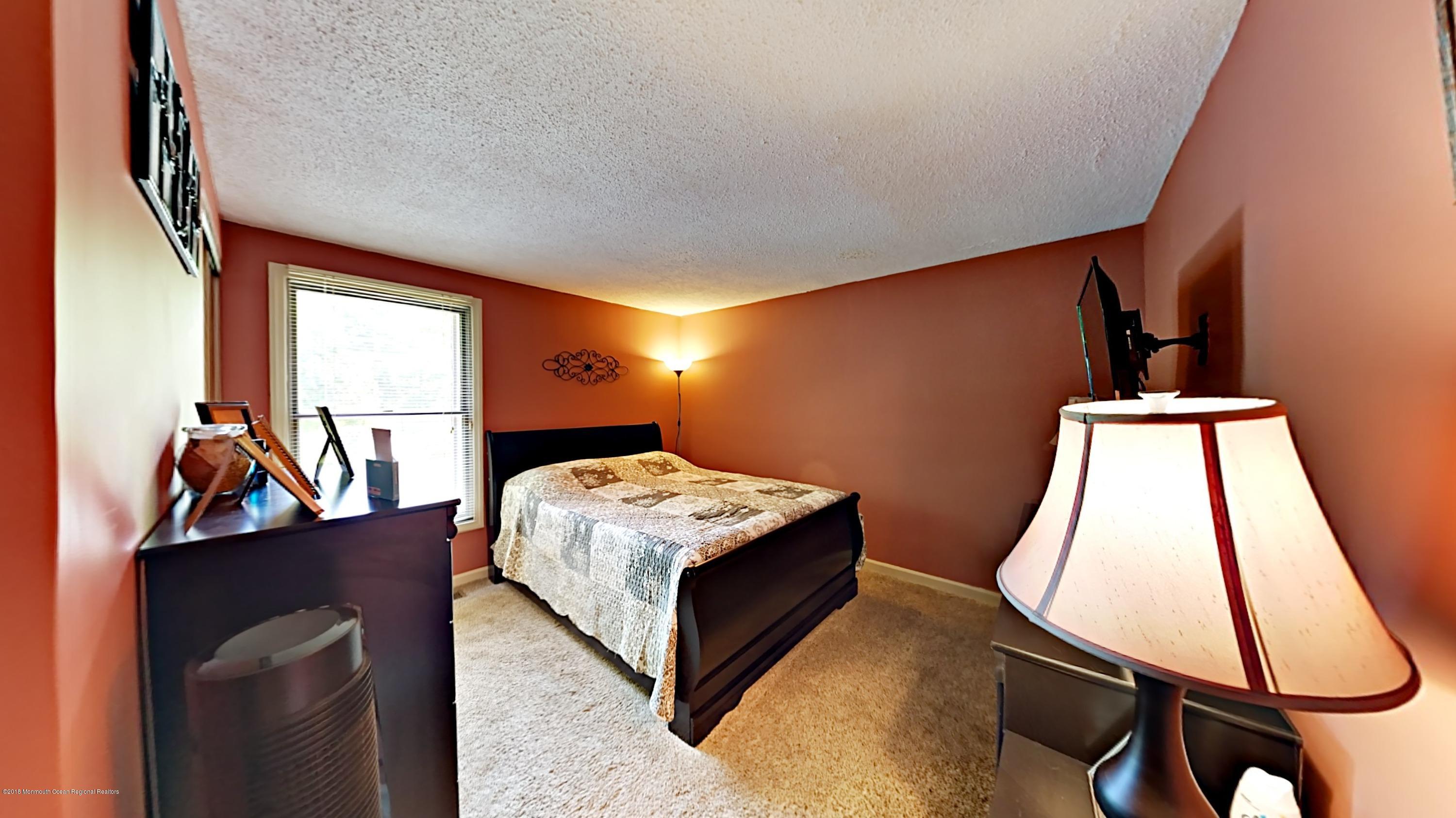890 Anderson Road Jackson, NJ 08527 - Photo 7 of 17 a room with a bed and a window