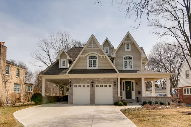 369 Downing Road Riverside, IL 60546 - Photo 1 of 46 a front view of a building with a garden