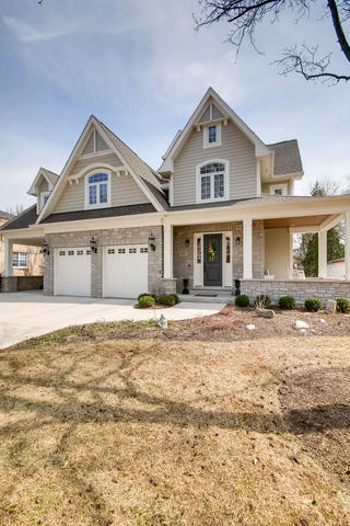 369 Downing Road Riverside, IL 60546 - Photo 2 of 46 a front view of a house with a yard