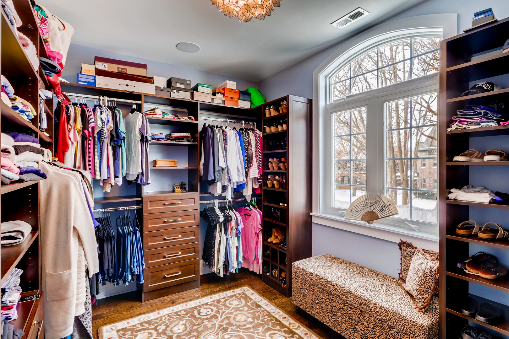 369 Downing Road Riverside, IL 60546 - Photo 24 of 46 a view of walk in closet with clothes and shoes