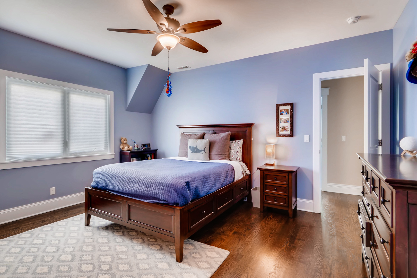 369 Downing Road Riverside, IL 60546 - Photo 28 of 46 a bedroom with a bed and a chandelier