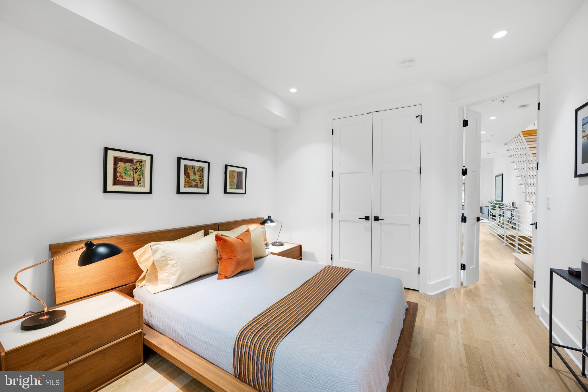 1806 9th Street Northwest, Unit 2 Washington, DC 20001 - Photo 13 of 40 a bedroom with a bed and wooden floor