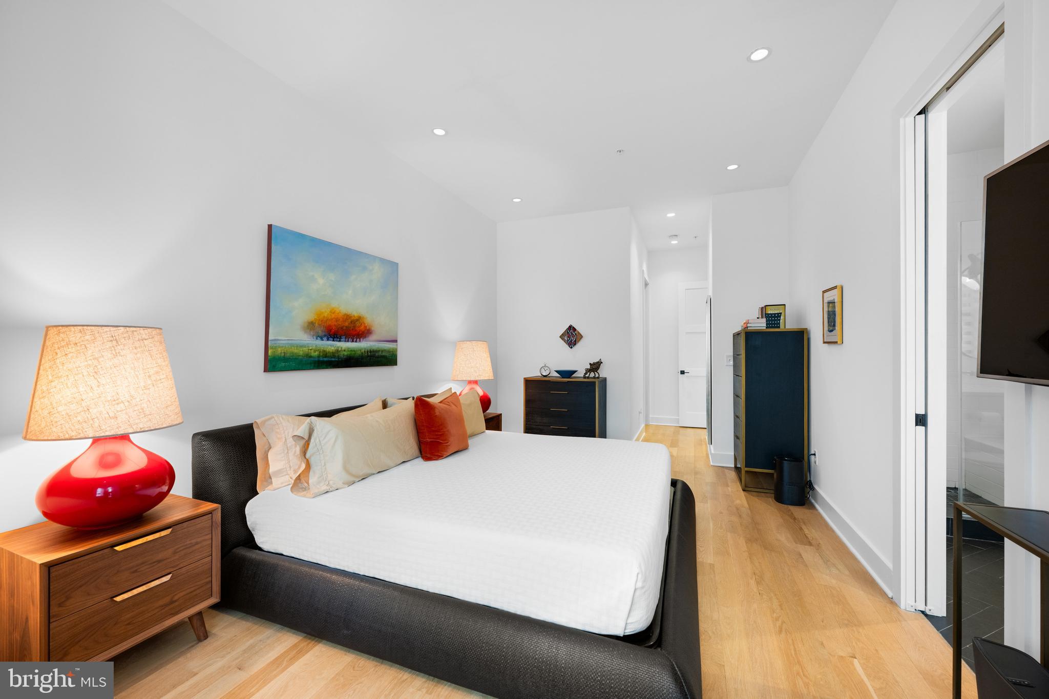 1806 9th Street Northwest, Unit 2 Washington, DC 20001 - Photo 18 of 40 a bed room with a bed and a television