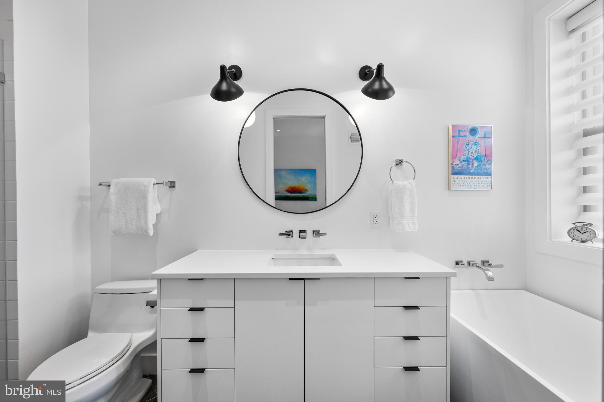 1806 9th Street Northwest, Unit 2 Washington, DC 20001 - Photo 19 of 40 a bathroom with a sink and a mirror