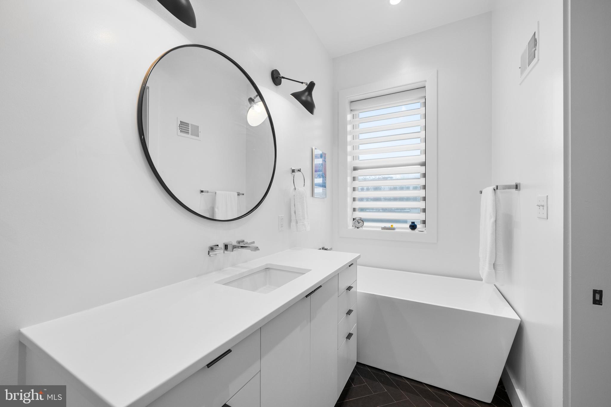 1806 9th Street Northwest, Unit 2 Washington, DC 20001 - Photo 21 of 40 a bathroom with a sink and a mirror