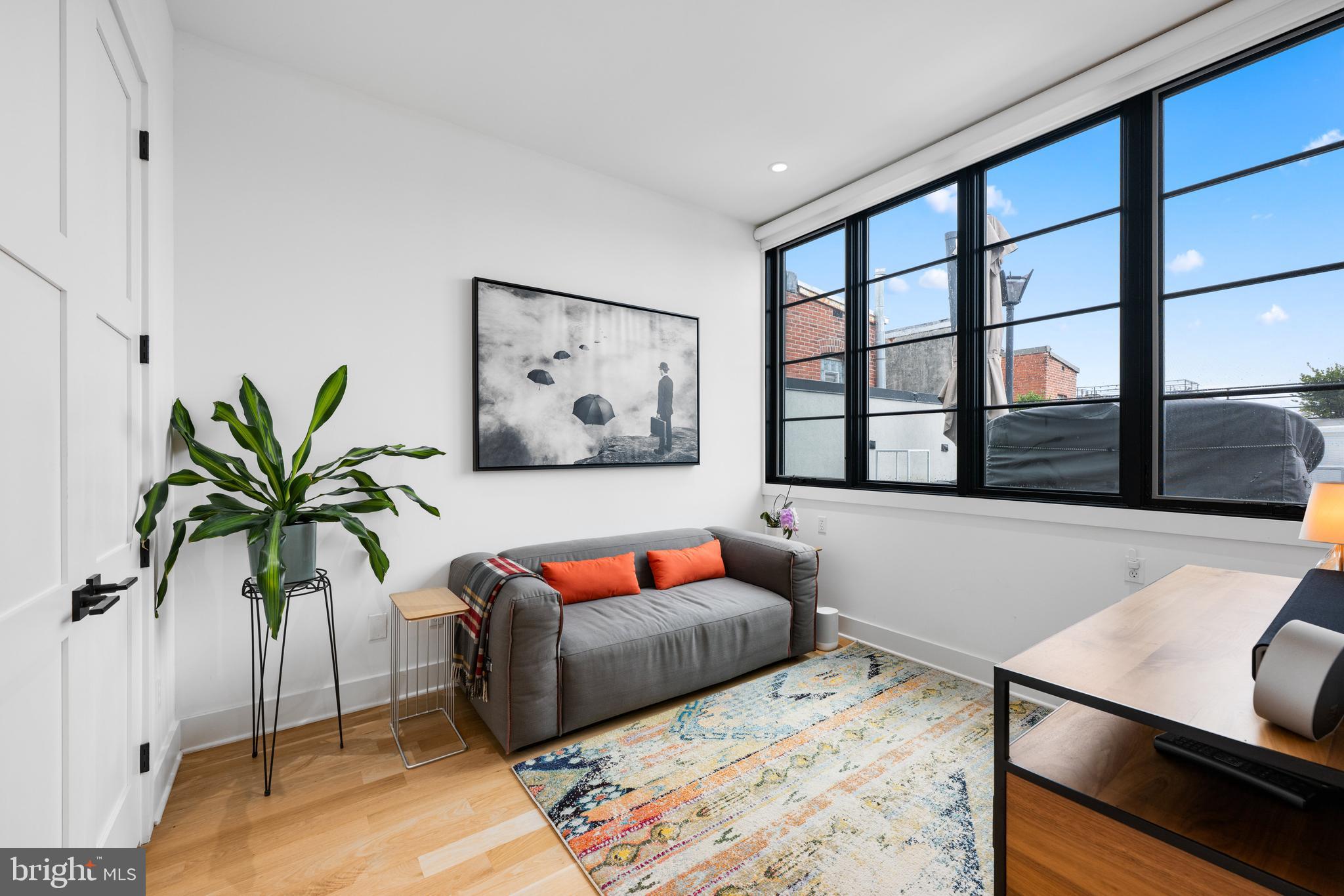 1806 9th Street Northwest, Unit 2 Washington, DC 20001 - Photo 22 of 40 a bedroom with furniture and a potted plant