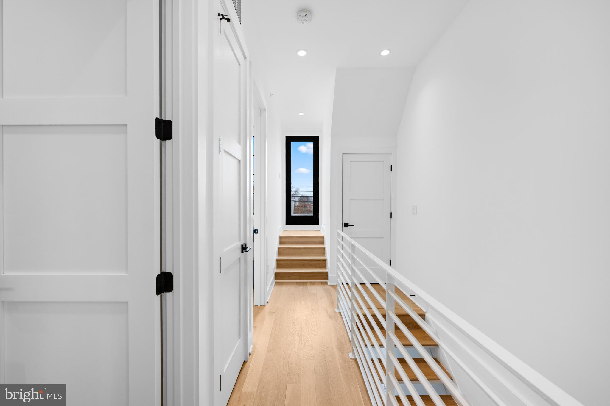 1806 9th Street Northwest, Unit 2 Washington, DC 20001 - Photo 25 of 40 a view of a hallway with wooden floor and staircase