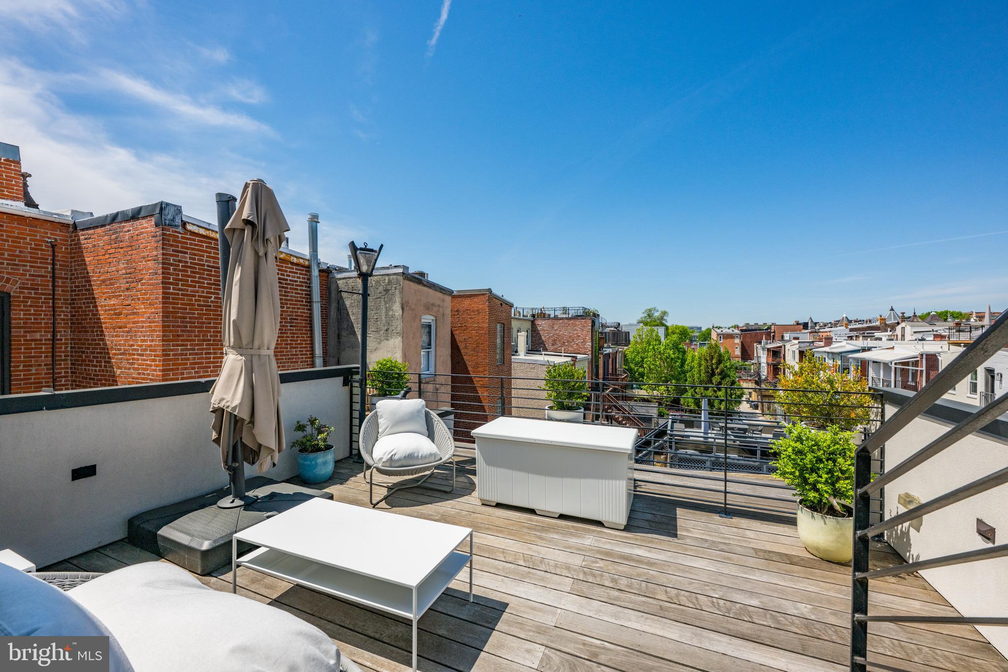 1806 9th Street Northwest, Unit 2 Washington, DC 20001 - Photo 26 of 40 a balcony with furniture and a potted plant