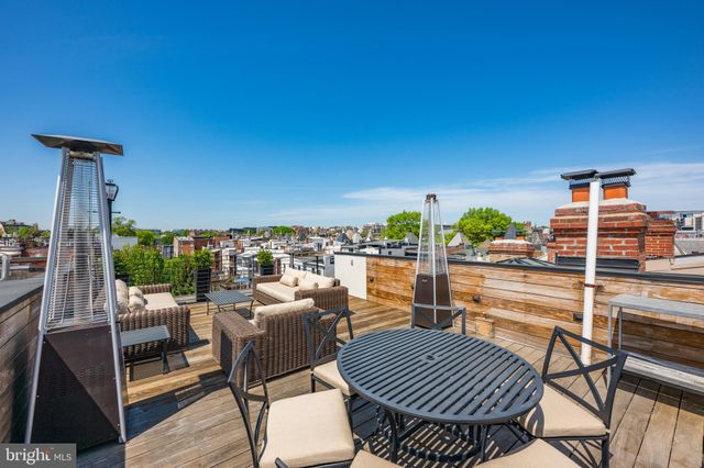 a view of a balcony with chairs