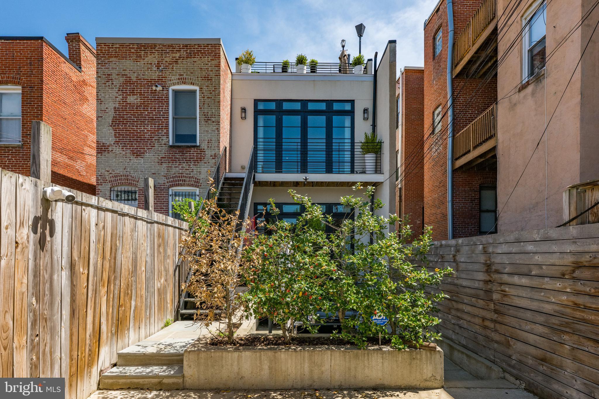 1806 9th Street Northwest, Unit 2 Washington, DC 20001 - Photo 38 of 40 a view of a brick house with plants
