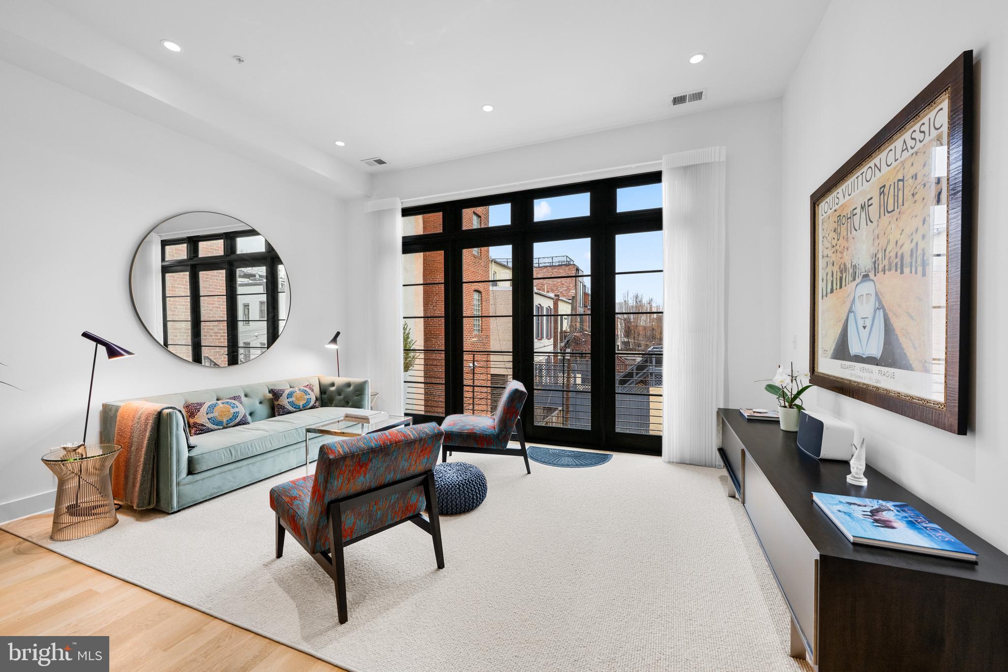 1806 9th Street Northwest, Unit 2 Washington, DC 20001 - Photo 8 of 40 a living room with furniture and a large window