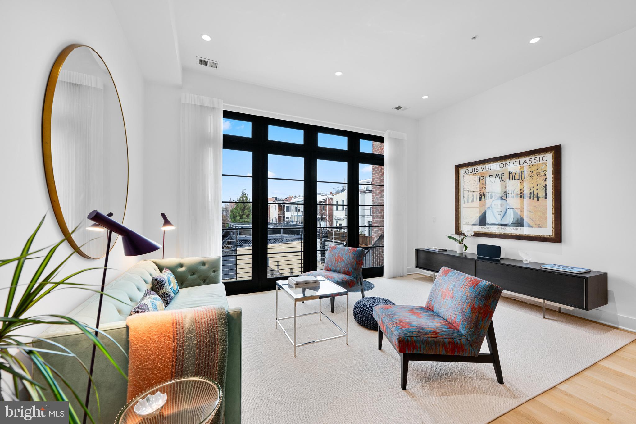 1806 9th Street Northwest, Unit 2 Washington, DC 20001 - Photo 9 of 40 a living room with furniture and a large window