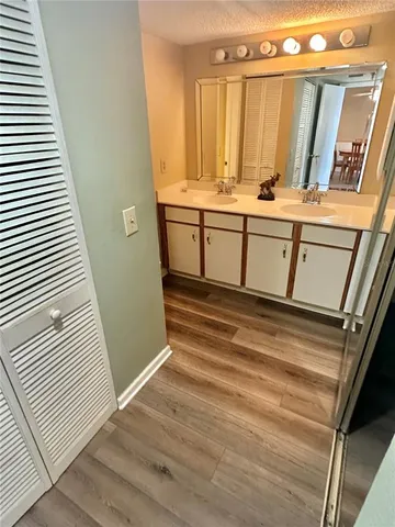 a view of a kitchen from a hallway