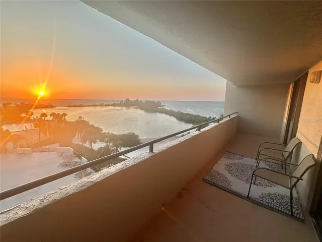 a view of roof deck with ocean view