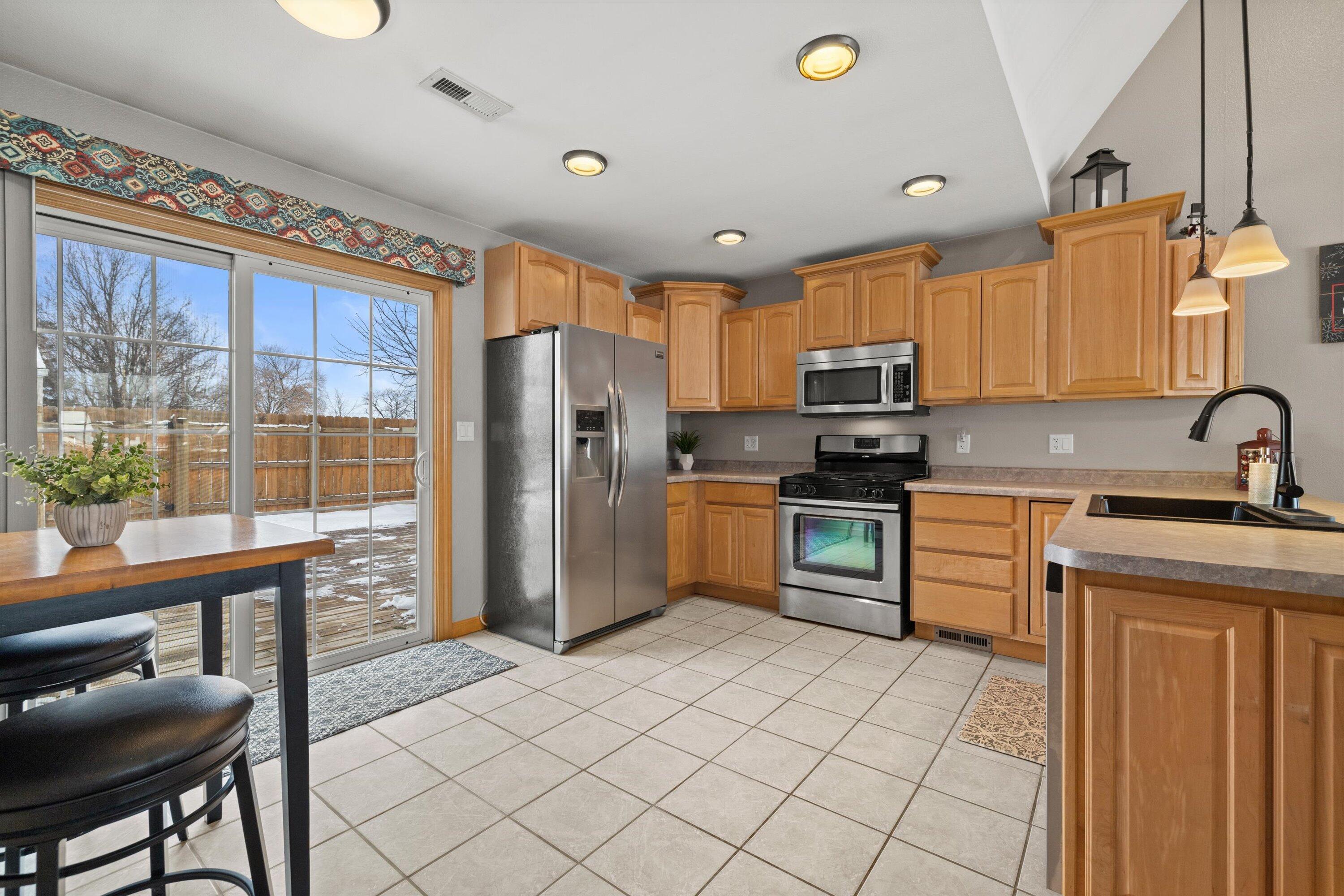 4100 Victory Avenue Racine, WI 53405 - Photo 15 of 26 Kitchen With Patio Door Leading To Deck
