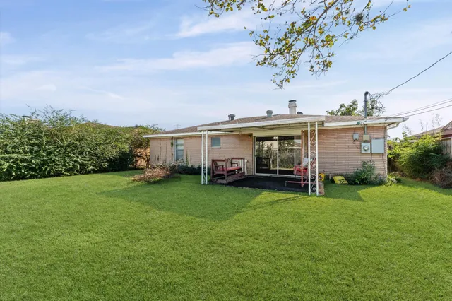 a view of a house with a garden