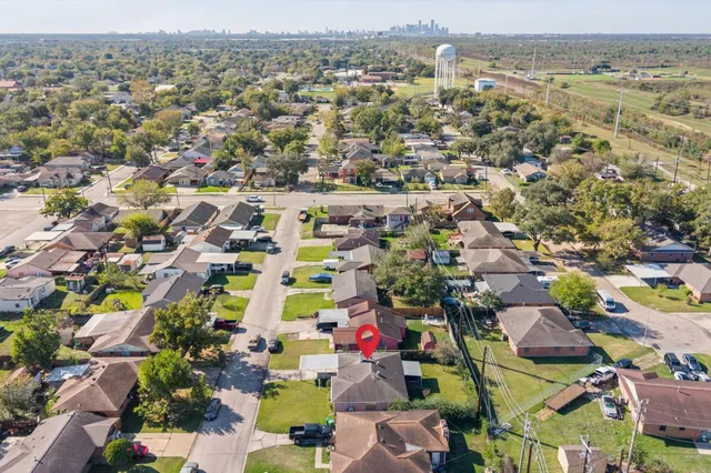 an aerial view of residential houses with outdoor space