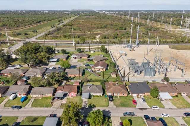 an aerial view of residential houses with outdoor space