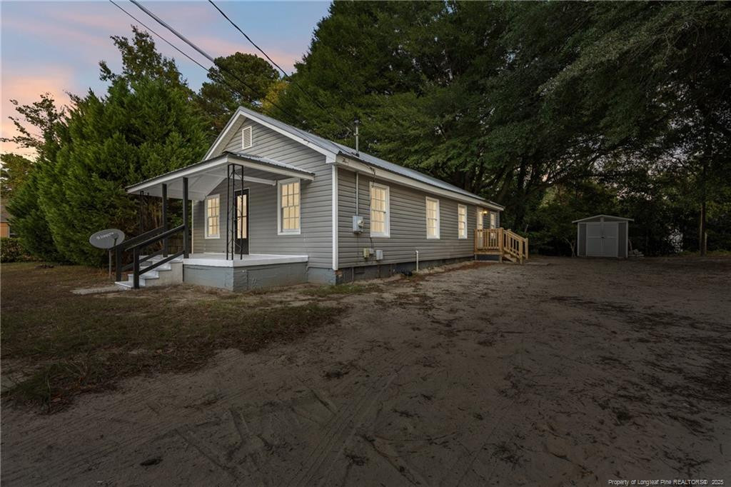 1601 Camden Road Fayetteville, NC 28306 - Photo 1 of 31 a front view of a house with a garden