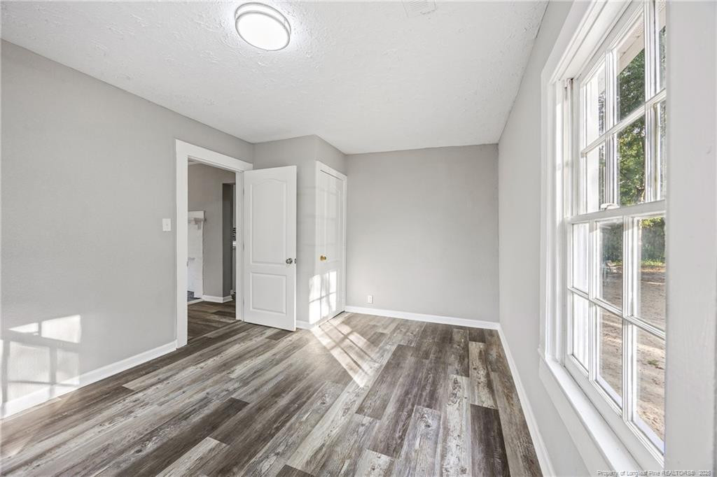 1601 Camden Road Fayetteville, NC 28306 - Photo 12 of 31 a view of a room with wooden floor and fence