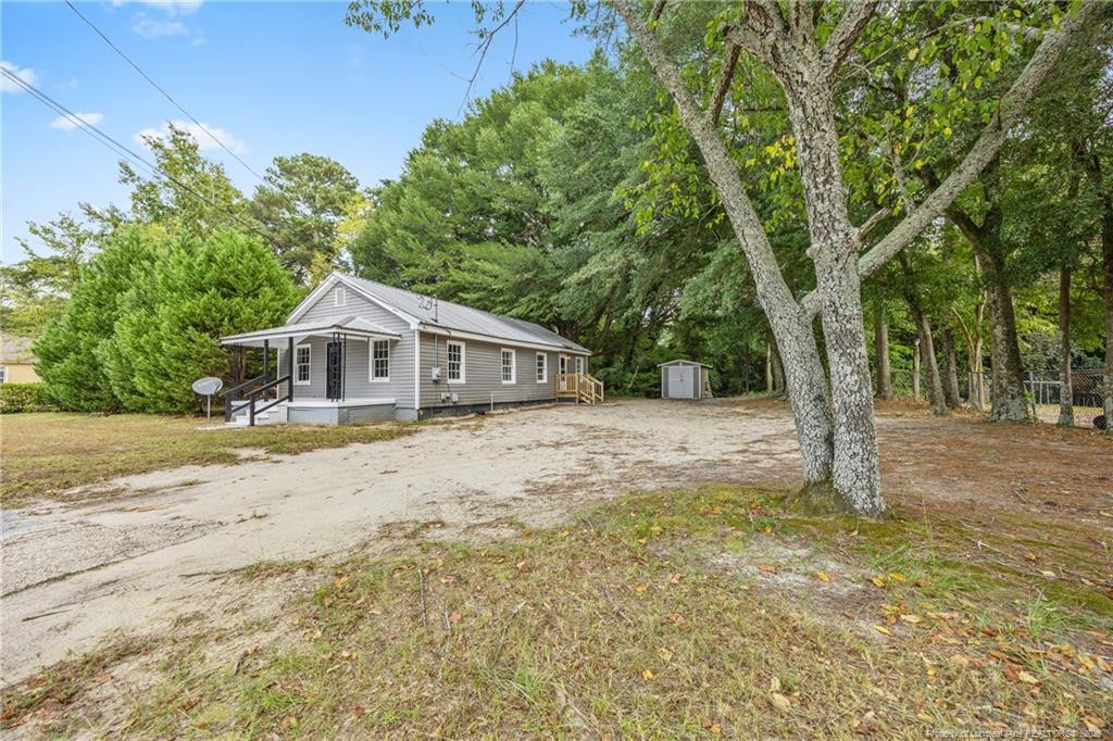 1601 Camden Road Fayetteville, NC 28306 - Photo 2 of 31 a front view of house with yard and trees