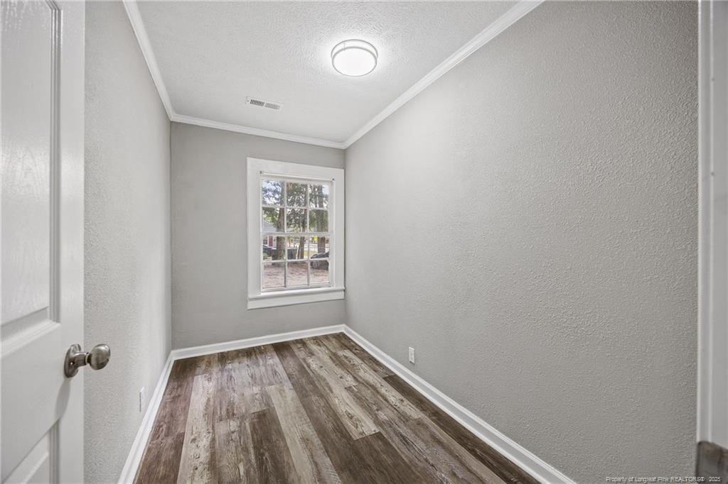 1601 Camden Road Fayetteville, NC 28306 - Photo 21 of 31 a view of a room with wooden floor and window