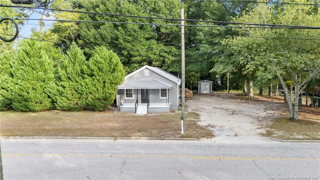 1601 Camden Road Fayetteville, NC 28306 - Photo 28 of 31 a front view of a house with a yard and garage