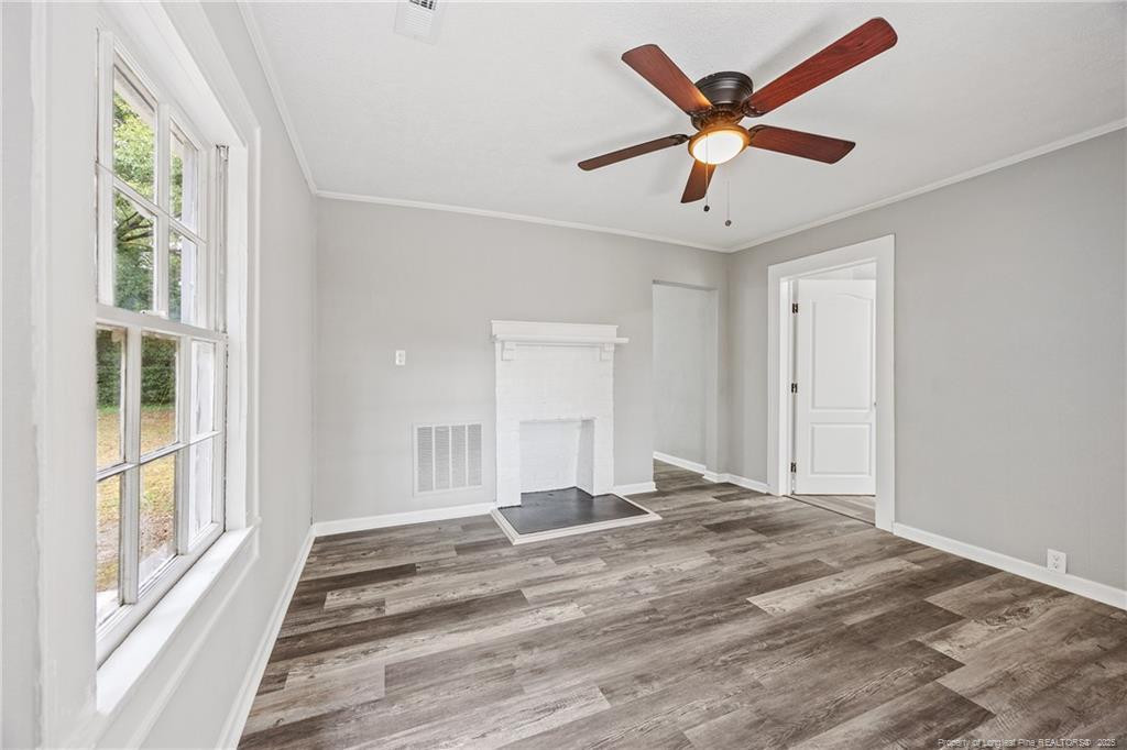 1601 Camden Road Fayetteville, NC 28306 - Photo 3 of 31 a view of a livingroom with a ceiling fan and window