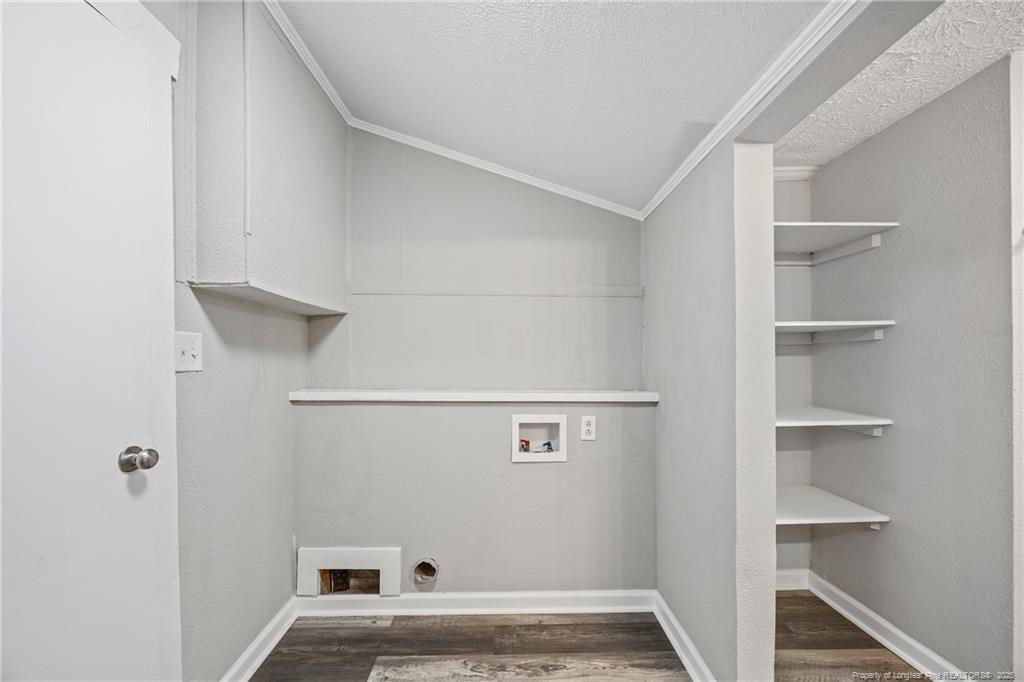 1601 Camden Road Fayetteville, NC 28306 - Photo 7 of 31 a view of storage and utility room with racks on the wall