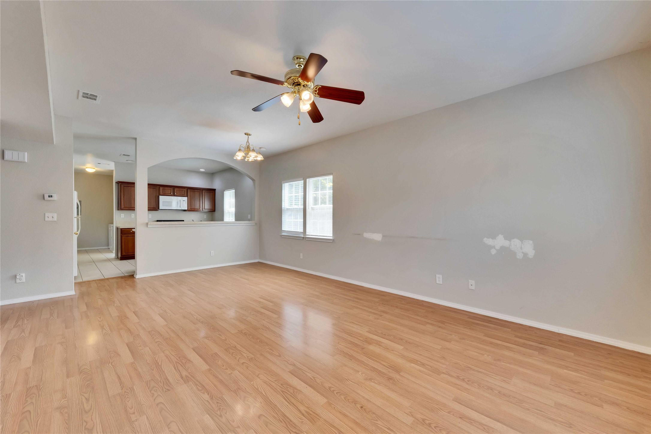 2201 East 18th Street, Unit B Austin, TX 78702 - Photo 25 of 25 An open floorplan living area flows seamlessly into the kitchen, creating an inviting atmosphere.