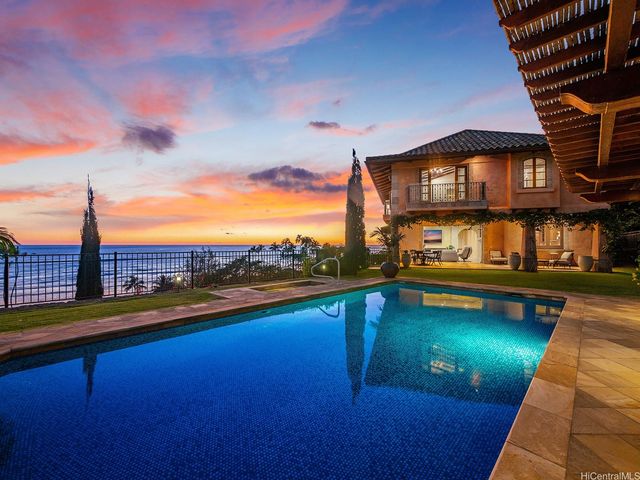 a view of swimming pool with a lounge chair