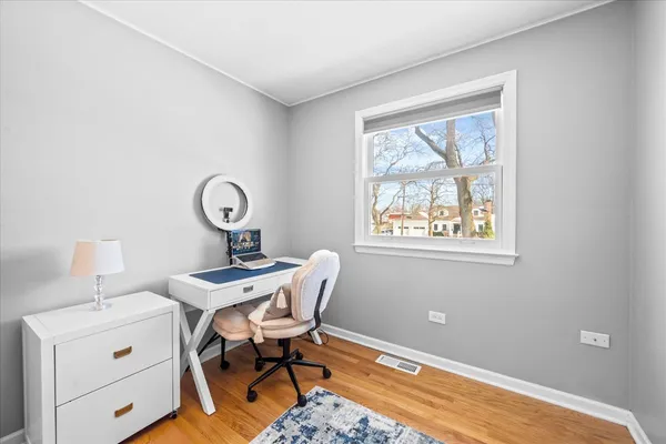 a workspace with furniture and a window