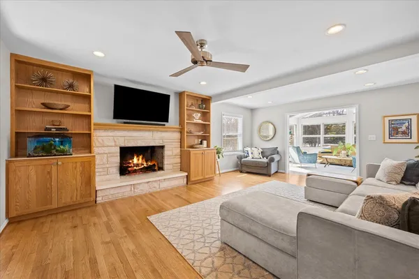 a living room with furniture fireplace and flat screen tv
