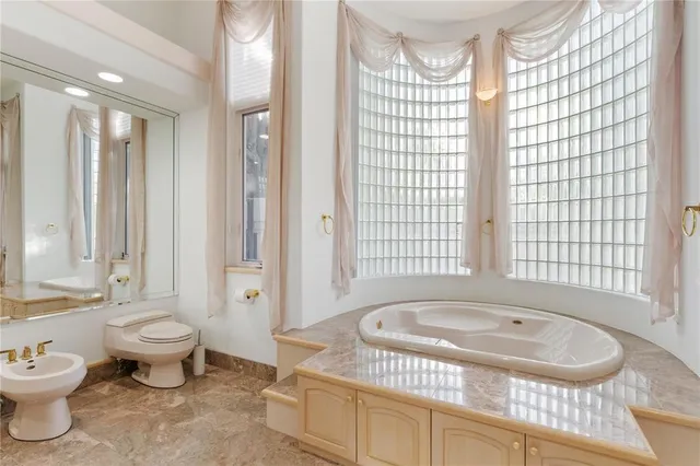 a view of a lake with houses in the background