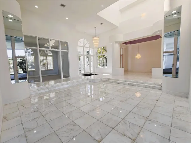 a spacious bathroom with a double vanity sink and a large mirror